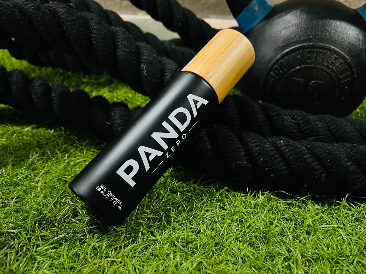 Panda Zero aluminum free body deodorant spray in black bottle with bamboo cap at the gym